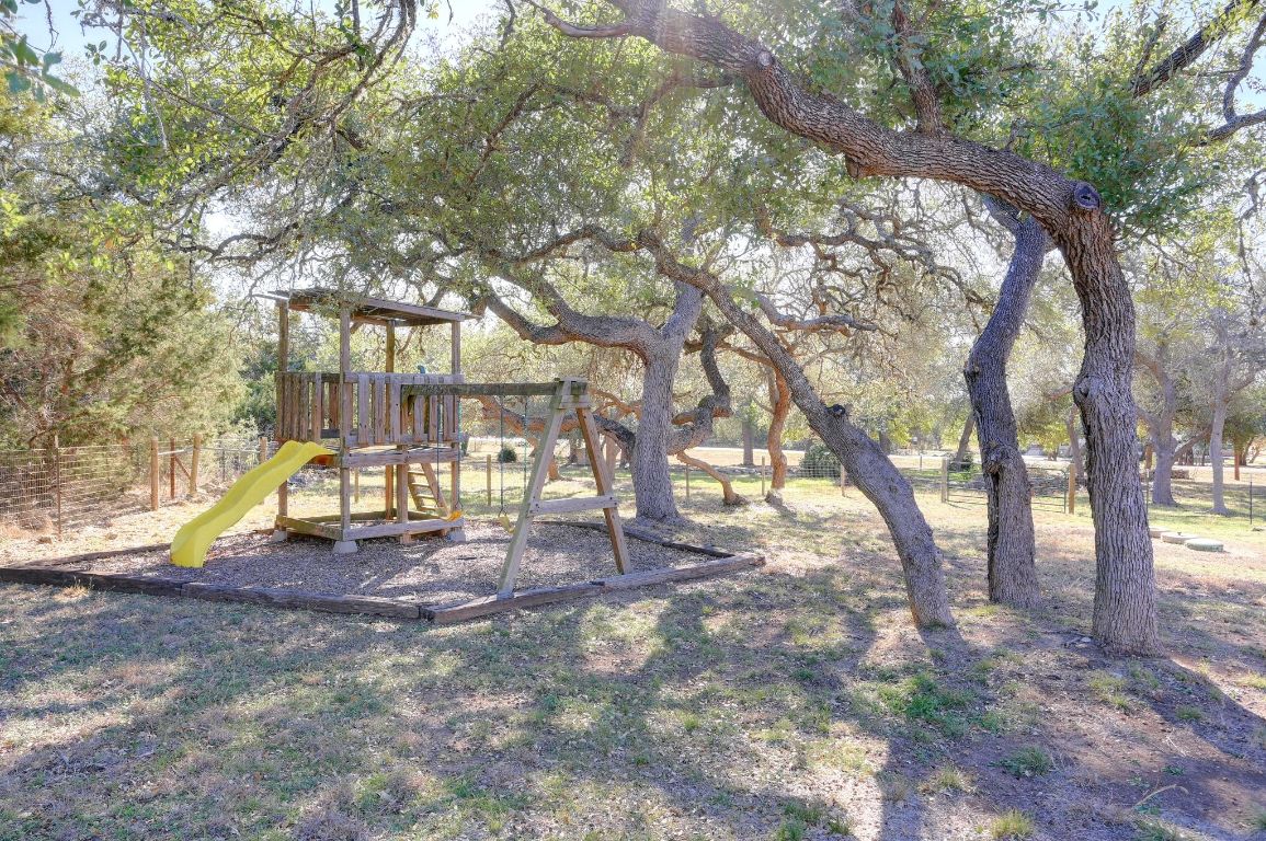 881 Saddle Ridge Drive Wimberley, TX 78676 - Photo 25 of 30 a view of yard with trees in the background