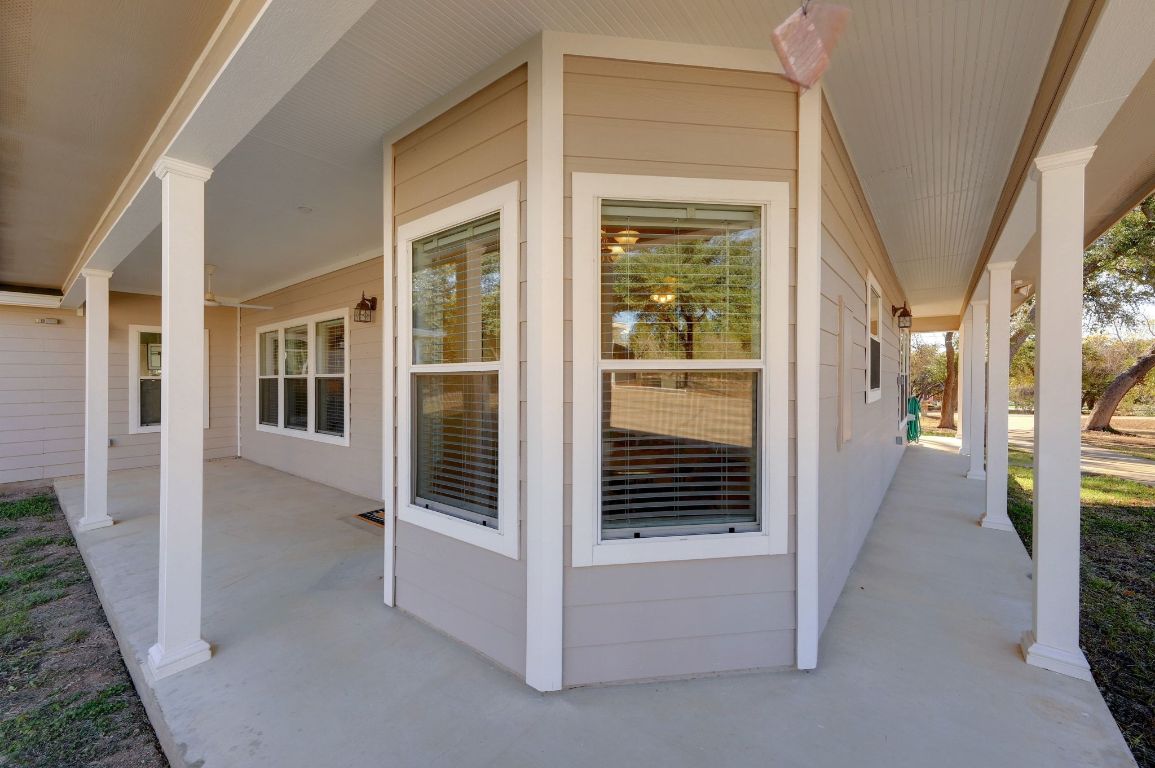 881 Saddle Ridge Drive Wimberley, TX 78676 - Photo 30 of 30 a view of a hallway with wooden shelves and door