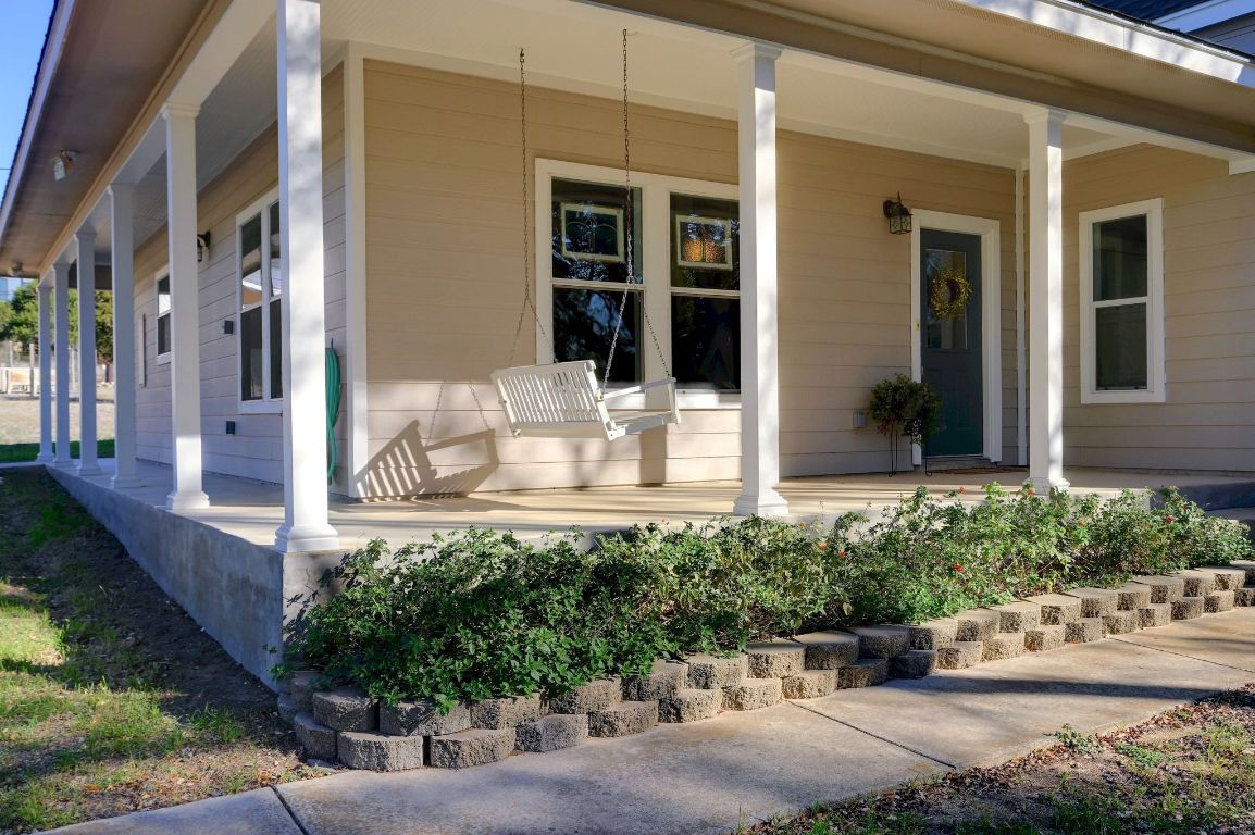 881 Saddle Ridge Drive Wimberley, TX 78676 - Photo 3 of 30 a view of a building with potted plants