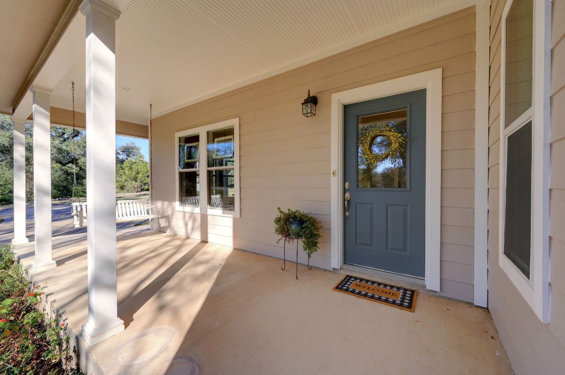 881 Saddle Ridge Drive Wimberley, TX 78676 - Photo 4 of 30 a view of a entryway door front of house