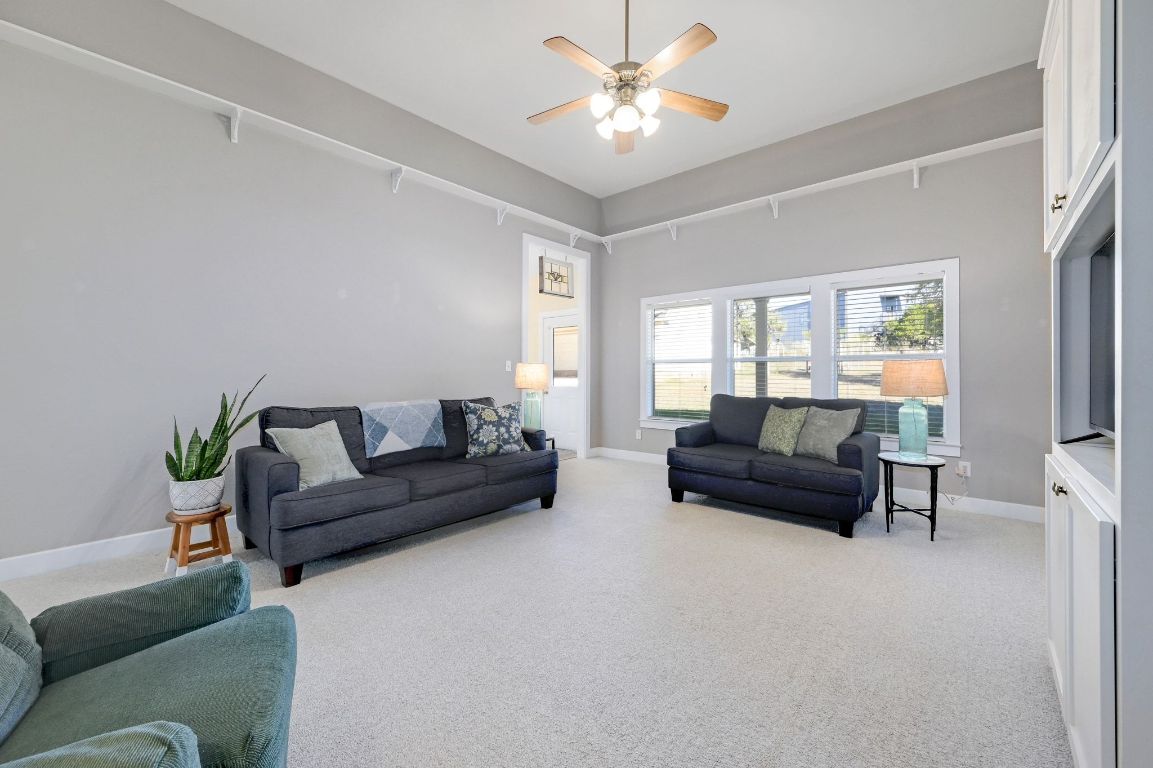 881 Saddle Ridge Drive Wimberley, TX 78676 - Photo 7 of 30 a living room with furniture and a window