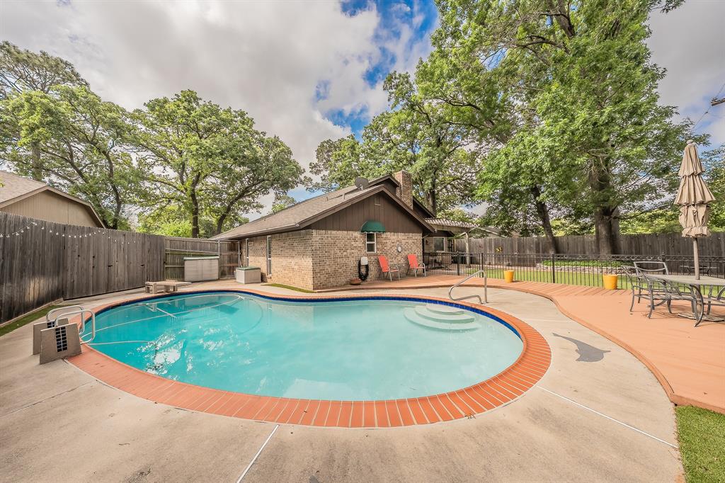 2003 Edgebrook Court Arlington, TX 76015 - Photo 2 of 40 a view of a house with swimming pool and sitting area