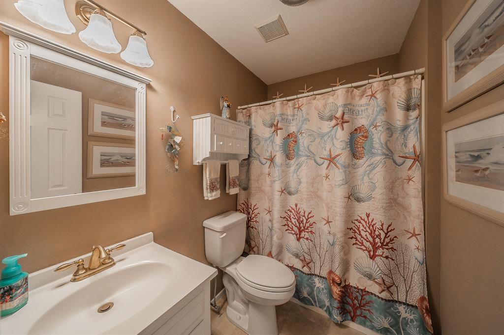 2003 Edgebrook Court Arlington, TX 76015 - Photo 26 of 40 a bathroom with a sink toilet and shower