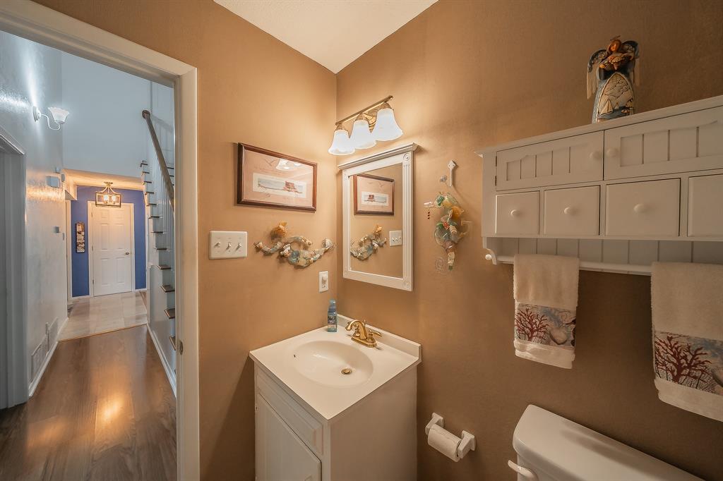 2003 Edgebrook Court Arlington, TX 76015 - Photo 27 of 40 a bathroom with a toilet sink and mirror
