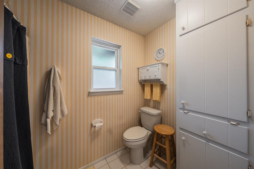2003 Edgebrook Court Arlington, TX 76015 - Photo 30 of 40 a bathroom with a toilet sink and shower