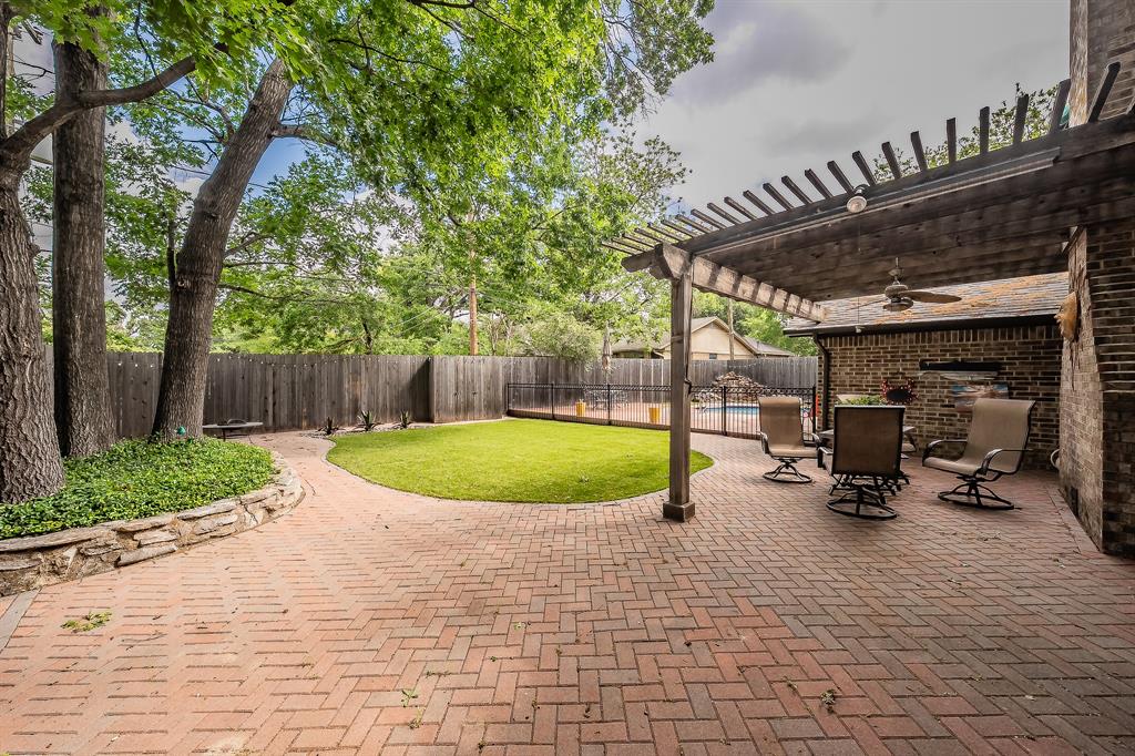 2003 Edgebrook Court Arlington, TX 76015 - Photo 3 of 40 a view of a swimming pool with a patio and wooden fence