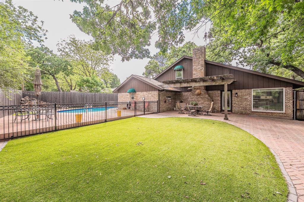 2003 Edgebrook Court Arlington, TX 76015 - Photo 6 of 40 a swimming pool with outdoor seating and yard