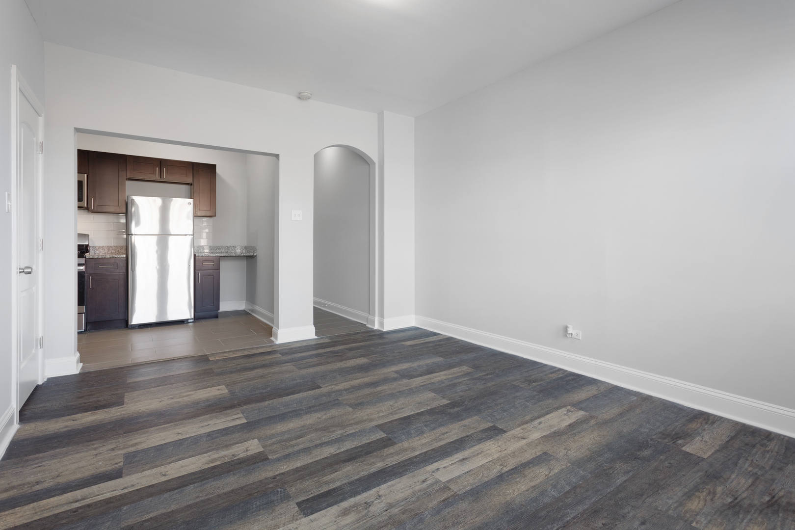 1608 West Sherwin Avenue, Unit 705 Chicago, IL 60626 - Photo 5 of 10 a view of empty room with wooden floor