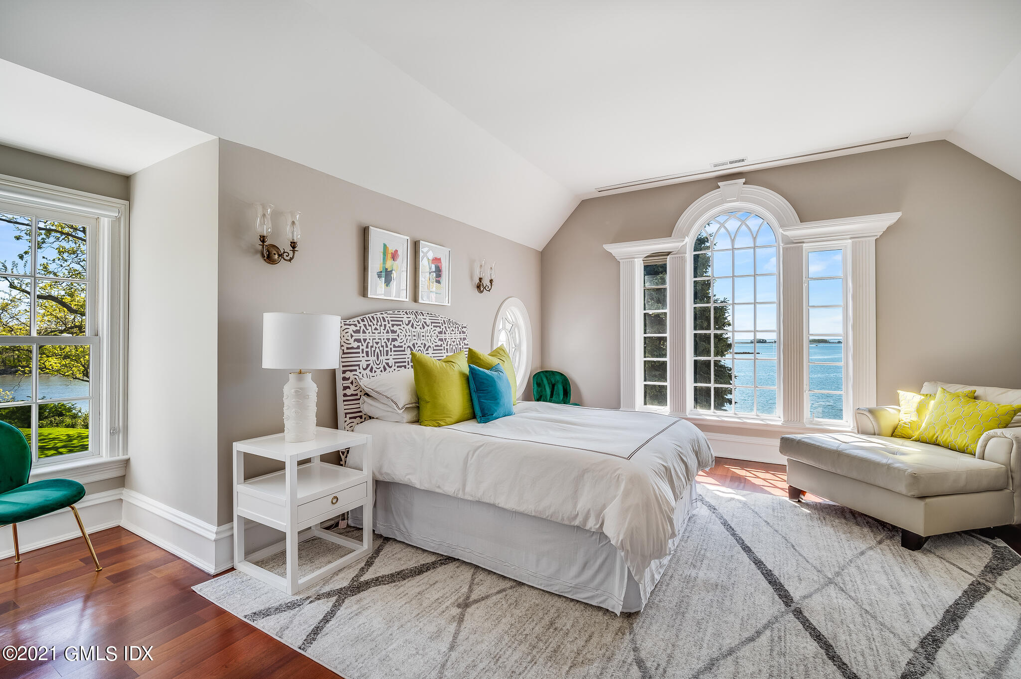 12 Valley Road Norwalk, CT 06854 - Photo 11 of 20 a bedroom with a bed mirror and a large window