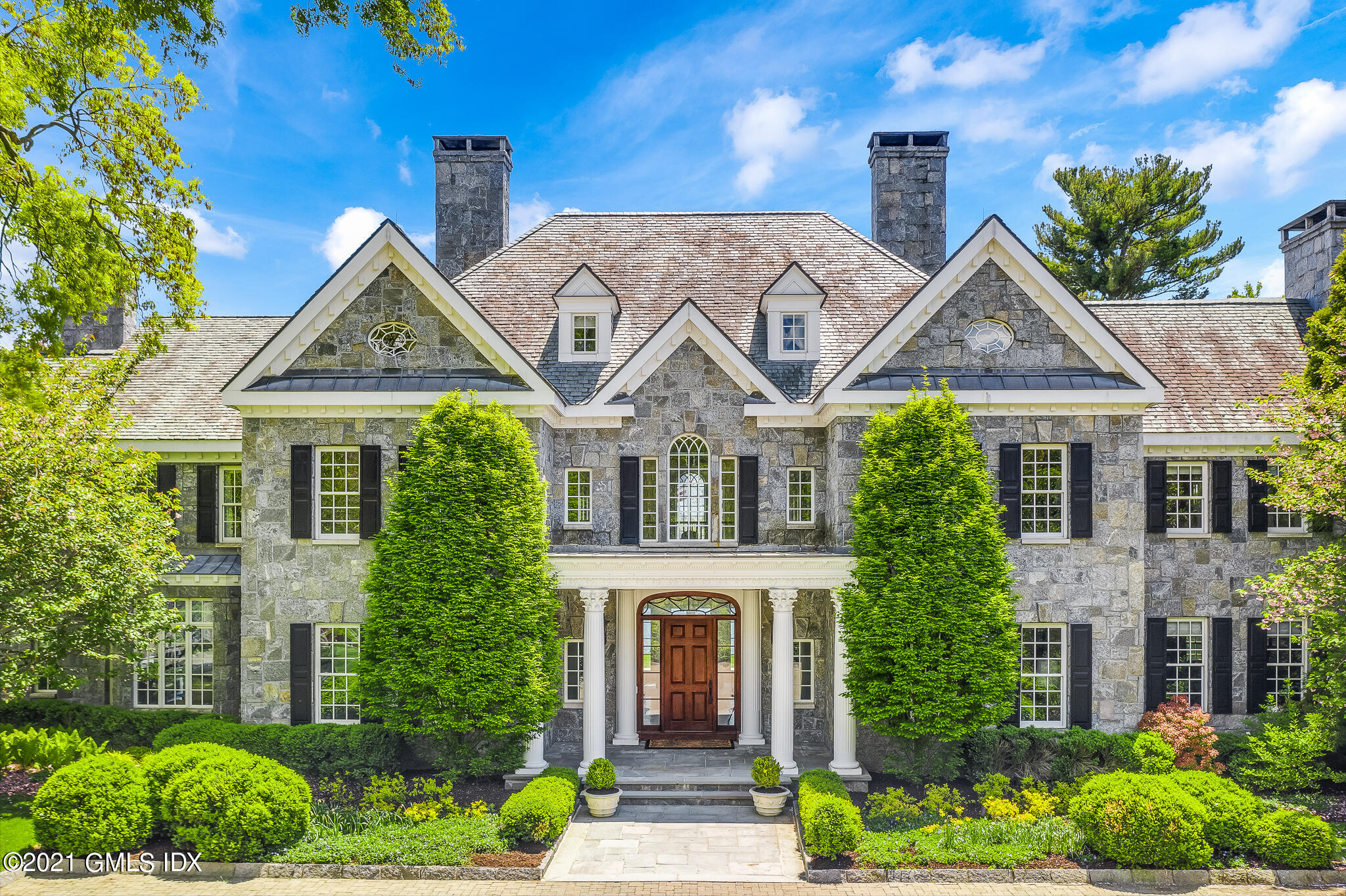 12 Valley Road Norwalk, CT 06854 - Photo 17 of 20 front view of a house with a garden