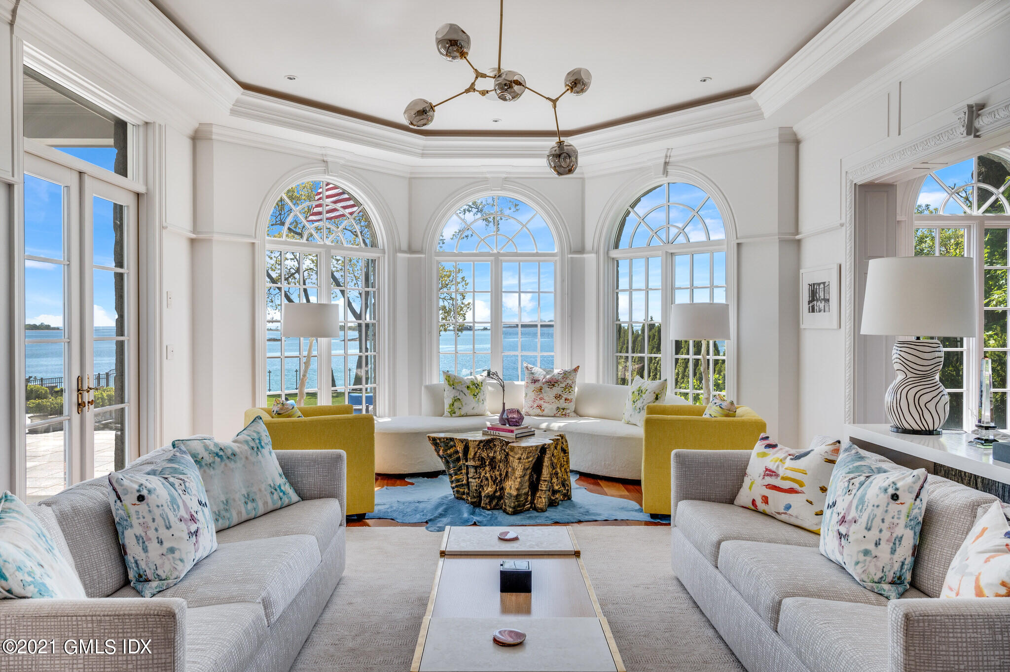 12 Valley Road Norwalk, CT 06854 - Photo 3 of 20 a living room with furniture chandelier and a large window