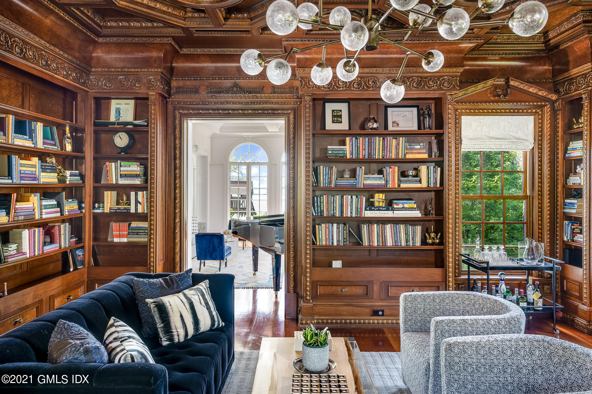 12 Valley Road Norwalk, CT 06854 - Photo 6 of 20 a living room with furniture a bookshelf and a window