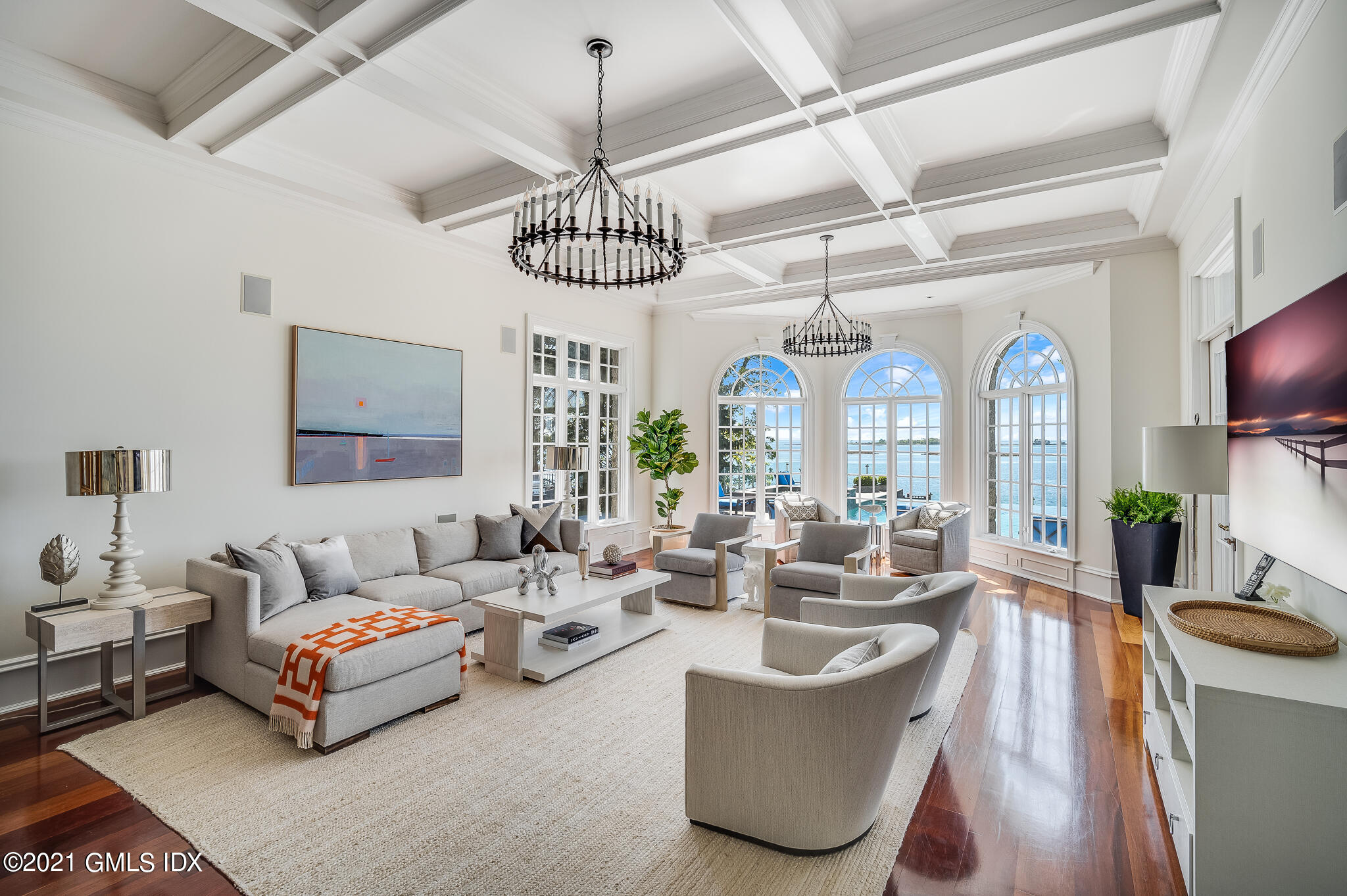 12 Valley Road Norwalk, CT 06854 - Photo 7 of 20 a living room with furniture a chandelier and a large window