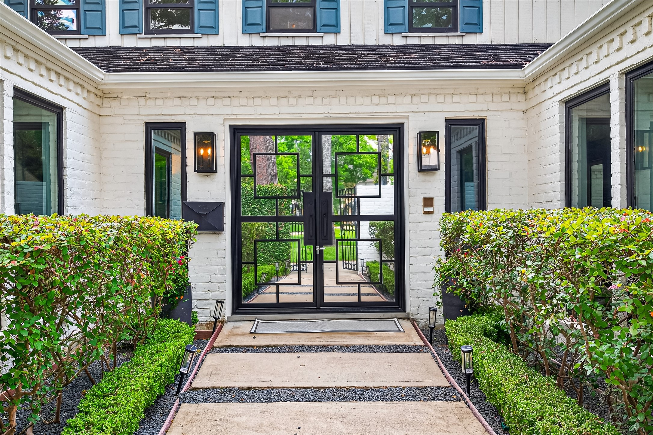 415 Ramblewood Road Houston, TX 77079 - Photo 3 of 49 Glass and steel doors welcome you.
