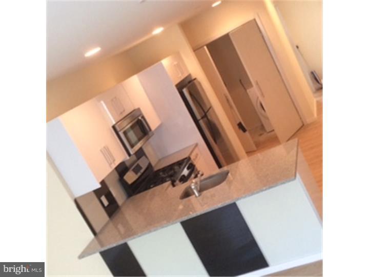 800 North 48th Street, Unit 47 Philadelphia, PA 19139 - Photo 2 of 20 a view of living room with washer and dryer