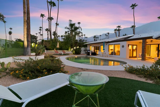 an aerial view of residential houses and outdoor space