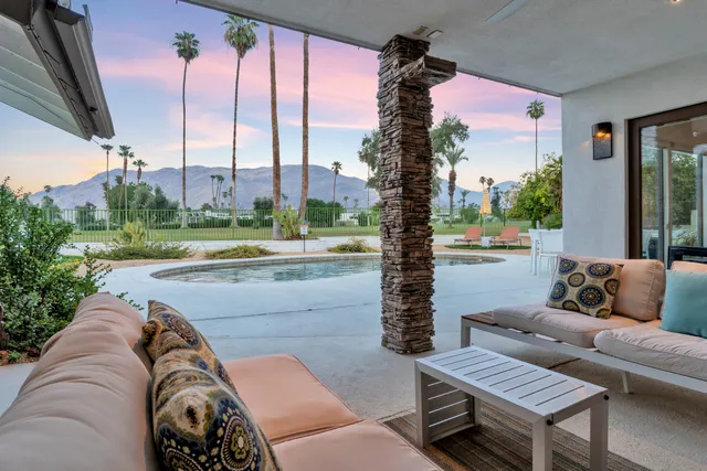 a view of a swimming pool with a patio
