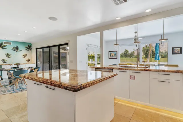 a bed room with a bed and a large window