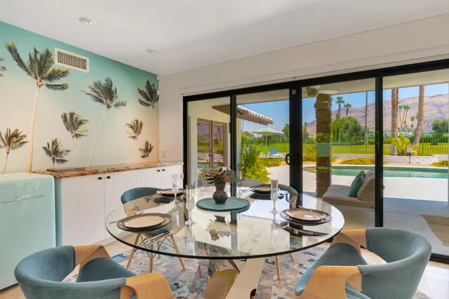 a bedroom with furniture and a flat screen tv