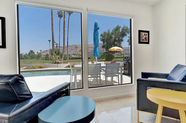 a view of a swimming pool with a lake view