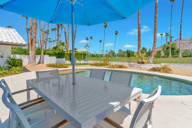 a view of a swimming pool with a patio