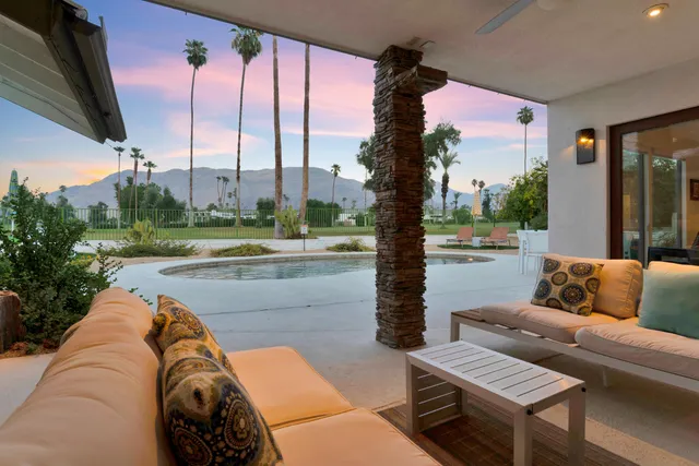 a view of a yard with furniture