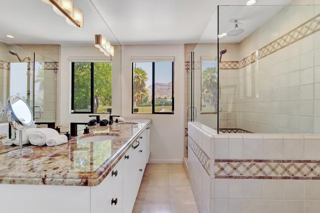 a view of multiple houses with a lake view