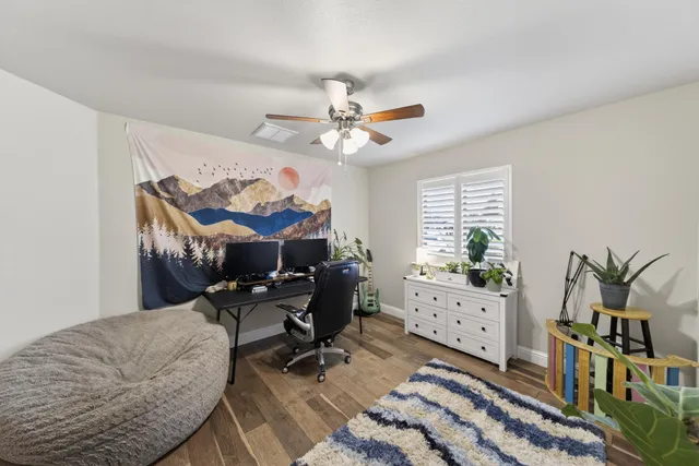 a living room with furniture a chandelier and a rug