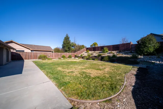 a view of a swimming pool with a yard