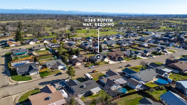 an aerial view of a houses with yard