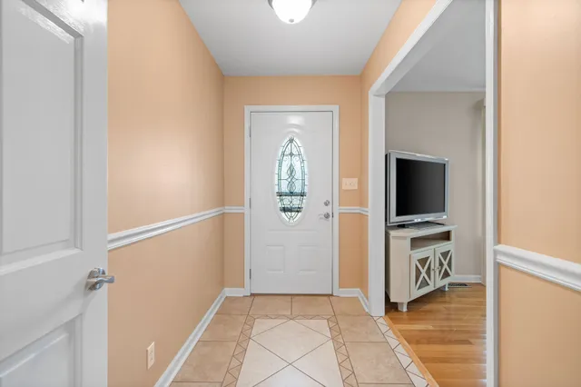 a kitchen with granite countertop a refrigerator stove top oven and sink