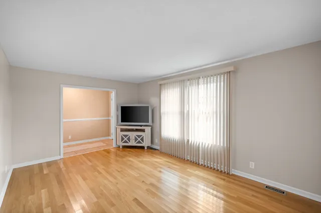 a view of livingroom with furniture and a flat screen tv