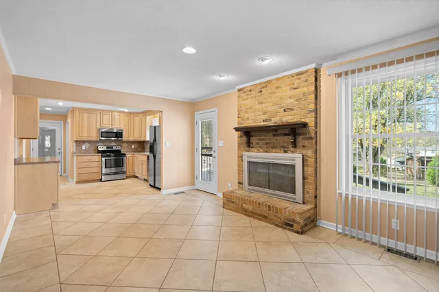 a view of a kitchen with furniture and a fireplace