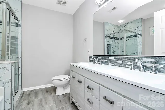 a view of storage and utility room with racks on the wall