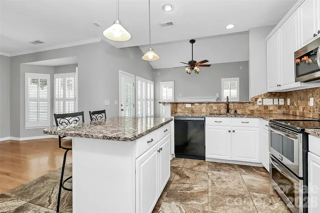 a living room with fireplace and a fireplace