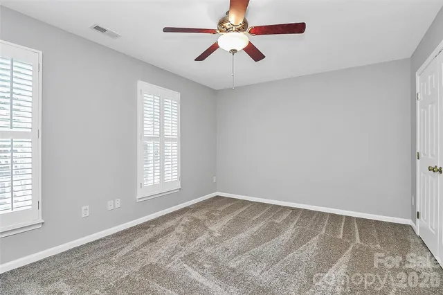 a view of a patio with a table and chairs