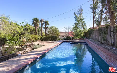 a view of swimming pool with chairs