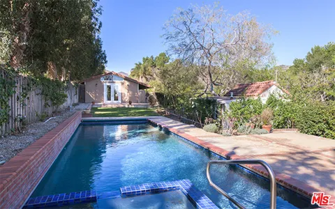a view of swimming pool with chairs