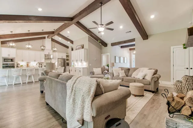 a dining room with kitchen island a table and chairs