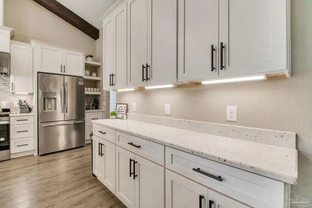 a dining room with furniture window and wooden floor