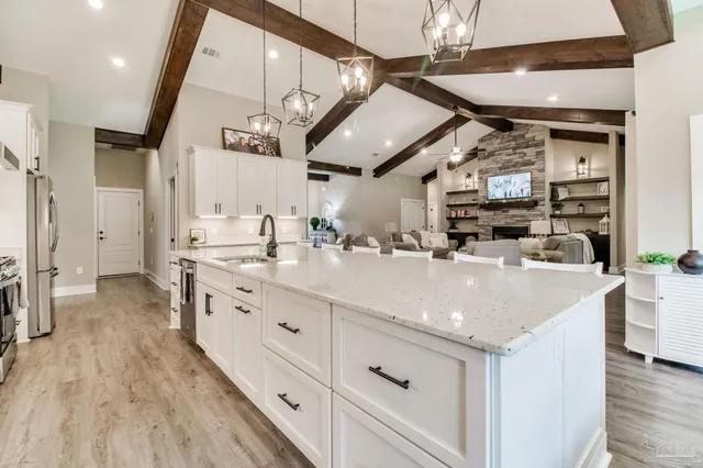 a view of bathroom with a tub shower vanity and mirror