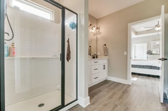 a bedroom with a large bed and a large window