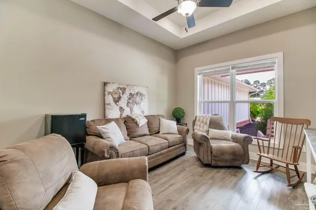 a view of a house with a big yard and sitting area