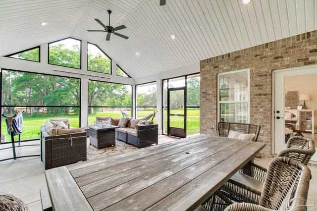 a kitchen with cabinets and chairs