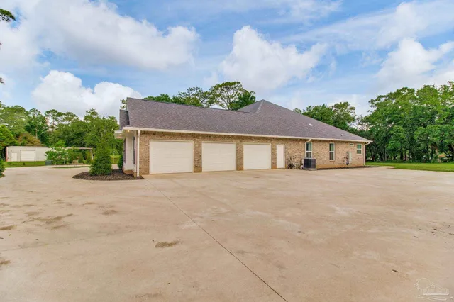 a kitchen with sink stove microwave and cabinets