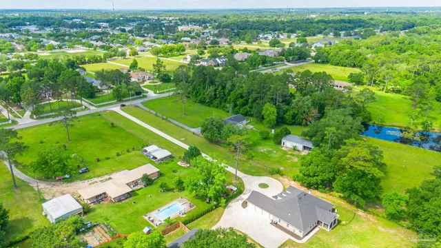 a view of a swimming pool with a yard
