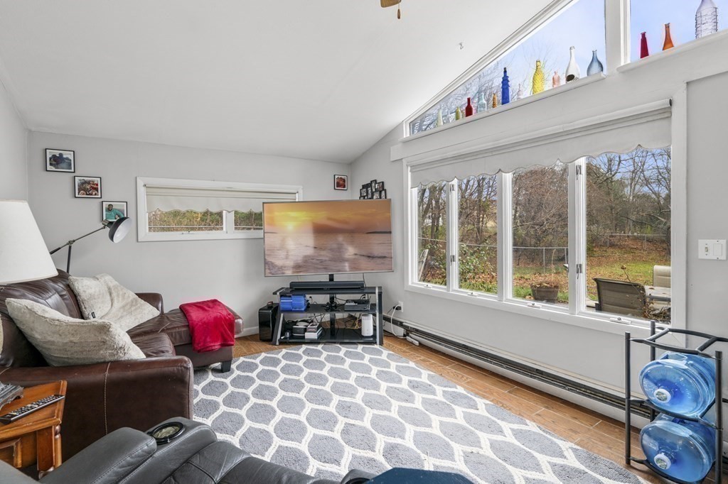 45 Burley Street Danvers, MA 01923 - Photo 11 of 41 a bedroom with furniture and a large window