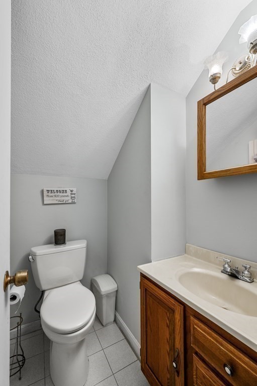 45 Burley Street Danvers, MA 01923 - Photo 12 of 41 a bathroom with a granite countertop toilet and a sink