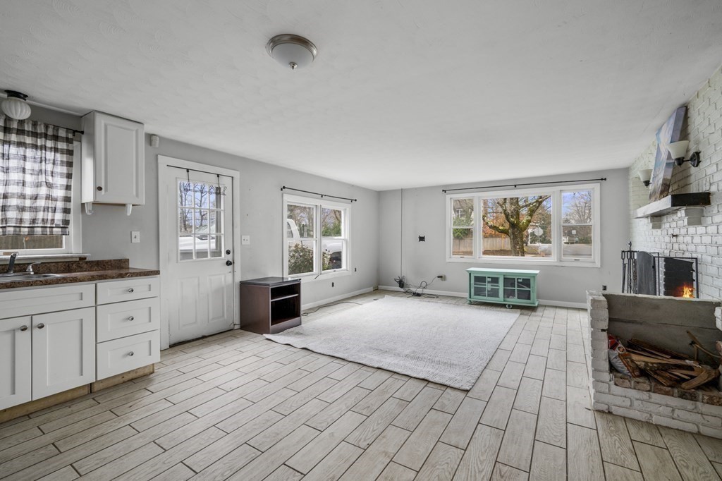 45 Burley Street Danvers, MA 01923 - Photo 15 of 41 a large bedroom with a bed and a flat screen tv