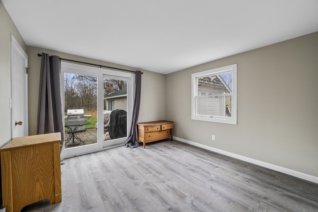 45 Burley Street Danvers, MA 01923 - Photo 19 of 41 a living room with furniture and a fireplace